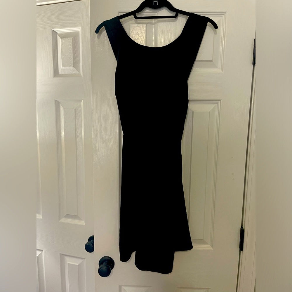 Cocktail black dress with sophisticated cross back. Size 4 from Loft